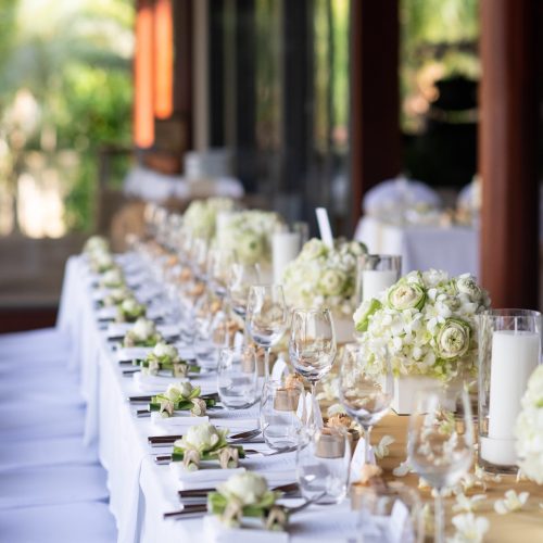 Wedding table set up and decorations with flowers and candles